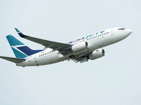 A WestJet plane takes off from Vancouver International Airport in Vancouver on Monday, May 13, 2019.