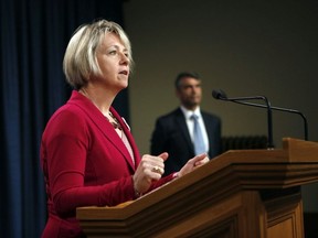 Provincial Health Officer Dr. Bonnie is joined by Chief Electoral Officer Anton Boegman as they update how the provincial election will be held during he novel coronavirus as they hold a press conference at B.C. legislature in Victoria, B.C., on Tuesday September 22, 2020.