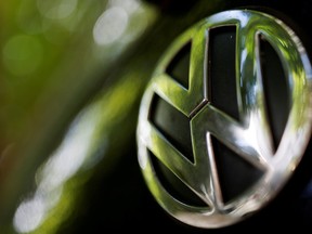 A logo of German carmaker Volkswagen is seen on a car parked on a street in Paris, France, July 9, 2020.