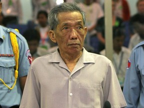 Former Khmer Rouge S-21 prison chief Kaing Guek Eav, better known as Duch, stands in a courtroom during a pre-trial in Phnom Penh, Dec. 5, 2008.