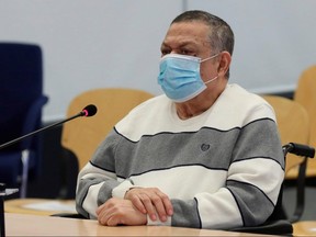 In this file photo taken on June 8, 2020 former Salvadoran colonel Inocente Montano looks on before the start of a trial for his participation in the murder of six Spanish Jesuit priests and two collaborators in 1989, in Madrid.