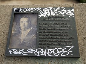 A vandalized plaque for Constable William L. Nixon in Constable Ezio Faraone Park, in Edmonton Friday Sept. 4, 2020.