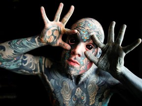 Sylvain, alias Freaky Hoody, a primary school teacher and France's "most tattooed man", poses with his eyes full of black ink at Palaiseau, southern Paris, France, September 25, 2020.