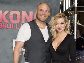 Mindy Robinson and Randy Couture attend the Los Angeles premiere of Warner Bros "Kong: Skull Island" at the Dolby Theatre, on March 8, 2017, in Hollywood, Calif.