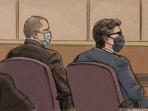 Former Minneapolis police officer Derek Chauvin sits with his lawyer during a court hearing on charges in the death of George Floyd in Minneapolis, Minnesota, U.S., September 11, 2020 in this courtroom sketch.