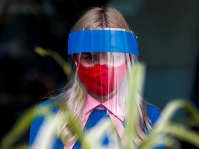 A restaurant employee wears a protective face shield and mask due to the coronavirus disease (COVID-19) outbreak in Moscow, Russia  July 8, 2020.