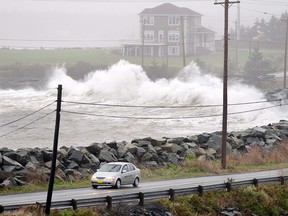 Waves hit the shore in Cow Bay, N.S. near Halifax on Tuesday, Oct. 30, 2012.