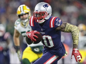 Josh Gordon of the New England Patriots runs with the ball against the Green Bay Packers at Gillette Stadium on November 4, 2018 in Foxborough, Mass.