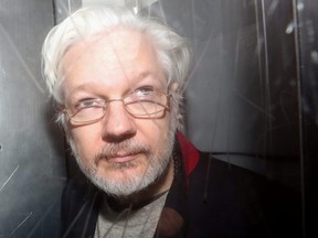 WikiLeaks' founder Julian Assange leaves Westminster Magistrates Court in London, Jan. 13, 2020.