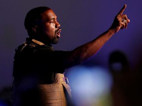 Rapper Kanye West gestures to the crowd as he holds his first rally in support of his presidential bid in North Charleston, S.C., July 19, 2020.