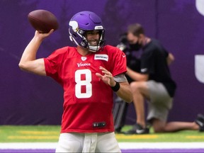 Minnesota Vikings quarterback Kirk Cousins (8) passes at practice at U.S. Bank Stadium.