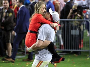 Patrick Mahomes of the Kansas City Chiefs celebrates with his girlfriend, Brittany Matthews, after defeating the San Francisco 49ers in Super Bowl LIV at Hard Rock Stadium on February 2, 2020 in Miami.