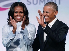 Former U.S. President Barack Obama and First Lady Michelle Obama arrive at the Obama Foundation Summit in Chicago, Oct. 31, 2017.