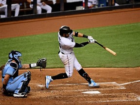 Marlins batter Miguel Rojas doubles in the 5th inning against the Blue Jays at Marlins Park, in Miami, Tuesday, Sept. 1, 2020.