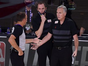 Mike D'Antoni of the Houston Rockets talks with a referee during the first quarter against the Los Angeles Lakers at AdventHealth Arena at the ESPN Wide World Of Sports Complex on September 6, 2020 in Lake Buena Vista, Florida.