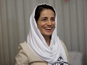 In this file photo taken Sept. 18, 2013, Iranian lawyer Nasrin Sotoudeh smiles at her house in Tehran after being freed following three years in prison.
