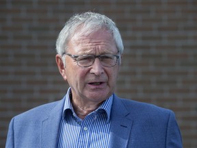 Premier Blaine Higgs talks with reporters after voting in the New Brunswick provincial election in Quispamsis, N.B., Monday, Sept. 14, 2020.
