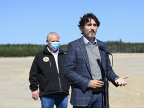 Canadian Prime Minister Justin Trudeau, front, speaks as Ontario Premier Doug Ford listens after taking part in a ground breaking event at the Iamgold Cote Gold mining site in Gogama, Ont., on Friday, September 11, 2020.