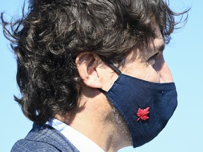 Prime Minister Justin Trudeau wear his mask as he takes part in a ground breaking event at the Iamgold Cote Gold mining site in Gogama, Ont., on Friday, Sept. 11, 2020.