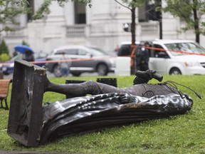 The statue of Sir John A. MacDonald is shown torn down following a demonstration in Montreal on Aug. 29, 2020.