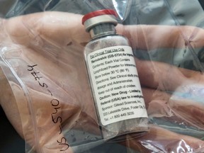 In this file photo one vial of the drug Remdesivir is shown during a press conference in Hamburg, Germany on April 8, 2020.