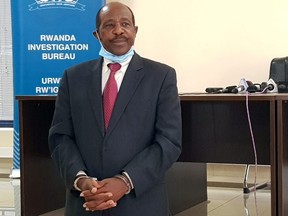 Paul Rusesabagina, the man who was hailed a hero in a Hollywood movie about the country's 1994 genocide, is paraded in front of media in handcuffs at the headquarters of Rwanda Investigation Bureau in Kigali, Rwanda August 31, 2020.