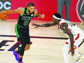 Celtics forward Jayson Tatum (looks for room to drive past Pascal Siakam of the Raptors during Game 2 on Tuesday. Tatum has outscored Siakam 55-30 through the first two games, both Boston wins.