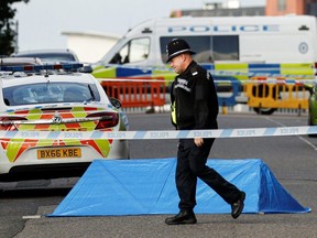 A police officer is seen near the scene of reported stabbings in Birmingham, England, Sunday, Sept. 6, 2020.