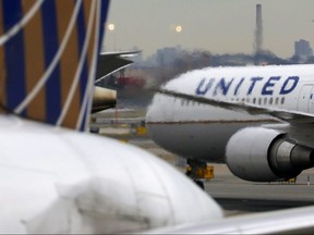 A United Airlines passenger jet taxis at Newark Liberty International Airport, New Jersey, December 6, 2019.