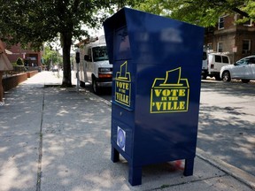 A box to drop off ballots, instead of attempting to mail them via the U.S. Postal Service (USPS), stands on a sidewalk in Somerville, Massachusetts, U.S., August 25, 2020.