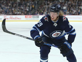 Winnipeg Jets forward Patrik Laine chases a loose puck in the Nashville Predators zone in Winnipeg on Tuesday, Feb. 4, 2020.