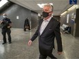 Just for Laughs founder Gilbert Rozon walks through hall at the Palais de Justice in Montreal on Tuesday before start of his trial on rape charges.
