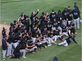 CHICAGO, ILLINOIS - OCTOBER 02: Members of the Miami Marlins celebrate a win over the Chicago Cubs during Game Two of the National League Wild Card Series at Wrigley Field on October 02, 2020 in Chicago, Illinois. The Marlins defeated the Cubs 2-0.