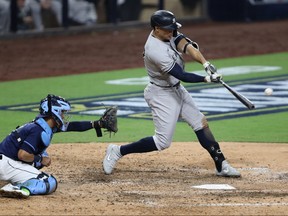 Giancarlo Stanton of the New York Yankees hits a grand slam against the Tampa Bay Rays during the ninth inning in Game One of the American League Division Series at PETCO Park on Oct. 5, 2020 in San Diego, Calif.