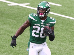 Le'Veon Bell of the New York Jets runs with the ball against the Arizona Cardinals at MetLife Stadium on Oct. 11, 2020 in East Rutherford, New Jersey.