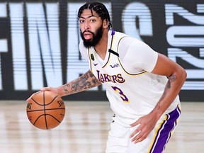 Anthony Davis of the Los Angeles Lakers drives the ball during the third quarter against the Miami Heat in Game Six of the 2020 NBA Finals at AdventHealth Arena at the ESPN Wide World Of Sports Complex on October 11, 2020 in Lake Buena Vista, Florida.