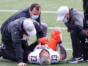 Odell Beckham Jr. of the Cleveland Browns lays on the field with an injury in the game against the Cincinnati Bengals during the first quarter at Paul Brown Stadium on October 25, 2020 in Cincinnati, Ohio.