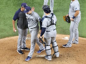 Pitcher Blake Snell of the Tampa Bay Rays is taken out of the game by manager Kevin Cash during the sixth inning against the Los Angeles Dodgers in Game 6 of the World Series at Globe Life Field in Arlington, Texas, on Ocyt. 27, 2020.