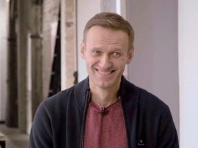Russian opposition politician Alexei Navalny smiles during an interview with prominent Russian YouTube blogger Yury Dud, in Berlin, Germany, in this still image taken from a handout video released Oct. 6, 2020.