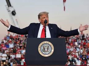 U.S. President Donald Trump speaks during a campaign rally, his first since being treated for COVID-19, at Orlando Sanford International Airport in Sanford, Fla., Oct. 12, 2020.