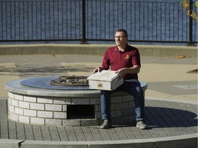 Herb Kenny, President, PPCLI Association of Edmonton, holds the time capsule that he retrieved after a military monument in Patricia Park was vandalized and plaques stolen, exposing the time capsule inside the base of the monument.