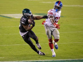Philadelphia Eagles running back Boston Scott (35) makes a touchdown catch past New York Giants strong safety Jabrill Peppers (21) during the fourth quarter at Lincoln Financial Field Oct. 22, 2020.