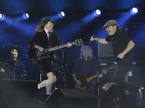 AC/DC’s Angus Young and Brian Johnson, with Cliff Wiliams (middle)i played a thunderous set at Downsview Park to over 40,000 fans during their Rock or Bust World Tour in Toronto on September 10, 2015.