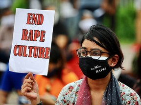 Members of a feminist group take part in an ongoing protest in front of the parliamentary building, demanding justice for the alleged gang rape of a woman in Noakhali, southern district of Bangladesh, October 10, 2020.