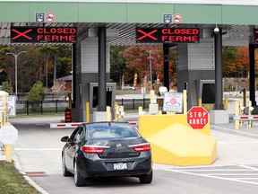 A car waits to enter Canada at the Canada-United States border crossing at the Thousand Islands Bridge in Lansdowne, Ont., Sept. 28, 2020.