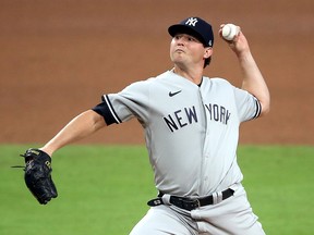 Zack Britton of the New York Yankees delivers a pitch against the Tampa Bay Rays during Game 5 of the American League Division Series at PETCO Park on October 9, 2020 in San Diego.