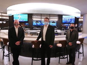 From left; Calgary International Airport CFO Richard Palmer, Arved von zur Muehlen, WestJet Chief Commercial Officer and Richard Bartram, WestJet vice-president corporate communications tour the new WestJet Elevation Lounge at the Calgary International Airport on Tuesday, October 27, 2020. The flagship lounge was in development for two years and is the first of its kind for WestJet, it opens to the public at the beginning of November.