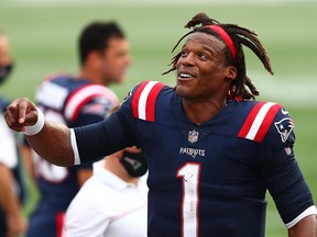 Cam Newton of the New England Patriots reacts on the sideline during a game against the Las Vegas Raiders at Gillette Stadium on September 27, 2020 in Foxborough, Massachusetts.