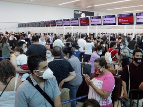 Tourists wait to depart from Cancun's international airport after Hurricane Delta hit October 8, 2020.