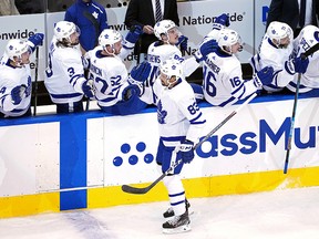 Cody Ceci of the Toronto Maple Leafs is congratulated by his teammates after scoring against the Columbus Blue Jackets at Scotiabank Arena on August 6, 2020 in Toronto.